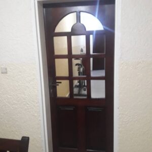 Dark wooden door with decorative glass panels