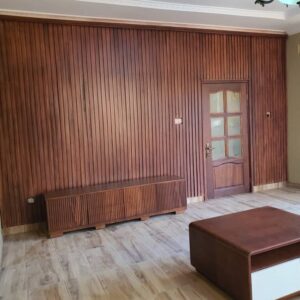 Modern built-in TV entertainment wall unit with hidden panels